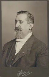 Bust Portrait of Leopold Methudy Wearing a Suit, Vest, and Bow Tie, Turned to the Left